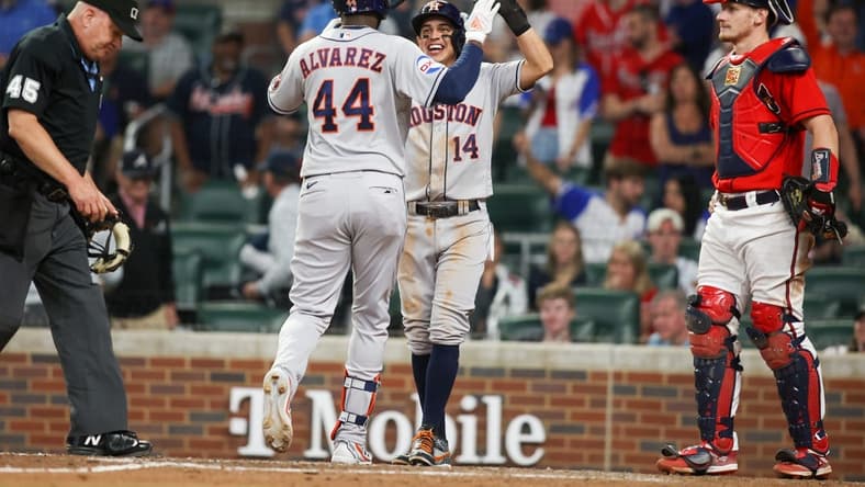 Apr 21, 2023; Atlanta, Georgia, USA; Houston Astros left fielder Yordan Alvarez (44) celebrates after a home run with second baseman Mauricio Dubon (14) against the Atlanta Braves in the ninth inning at Truist Park. Mandatory Credit: Brett Davis-USA TODAY Sports