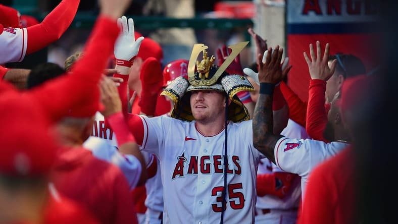 Apr 21, 2023; Anaheim, California, USA; Los Angeles Angels catcher Chad Wallach (35) is greeted after hitting a two run home run against the Kansas City Royals during the third inning at Angel Stadium. Mandatory Credit: Gary A. Vasquez-USA TODAY Sports
