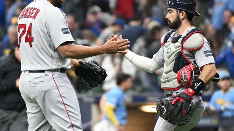 Apr 21, 2023; Milwaukee, Wisconsin, USA; Boston Red Sox relief pitcher Kenley Jansen (74) and catcher Connor Wong (12) celebrate a 5-3 win over the Milwaukee Brewers at American Family Field. Mandatory Credit: Michael McLoone-USA TODAY Sports