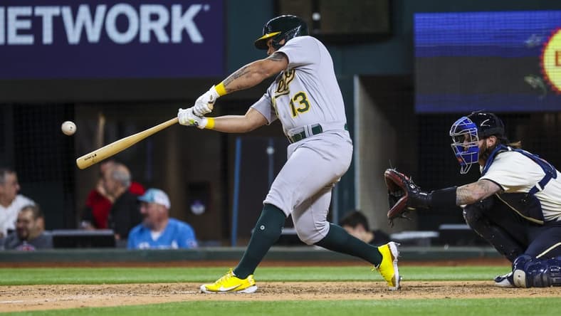 Apr 21, 2023; Arlington, Texas, USA;  Oakland Athletics second baseman Jordan Diaz (13) hits a home run during the ninth inning against the Texas Rangers at Globe Life Field. Mandatory Credit: Kevin Jairaj-USA TODAY Sports
