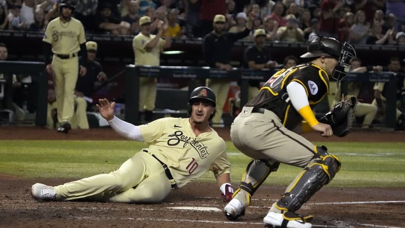 Apr 21, 2023; Phoenix, Arizona, USA; Arizona Diamondbacks third baseman Josh Rojas (10) scores a run against the San Diego Padres in the fifth inning at Chase Field. Mandatory Credit: Rick Scuteri-USA TODAY Sports