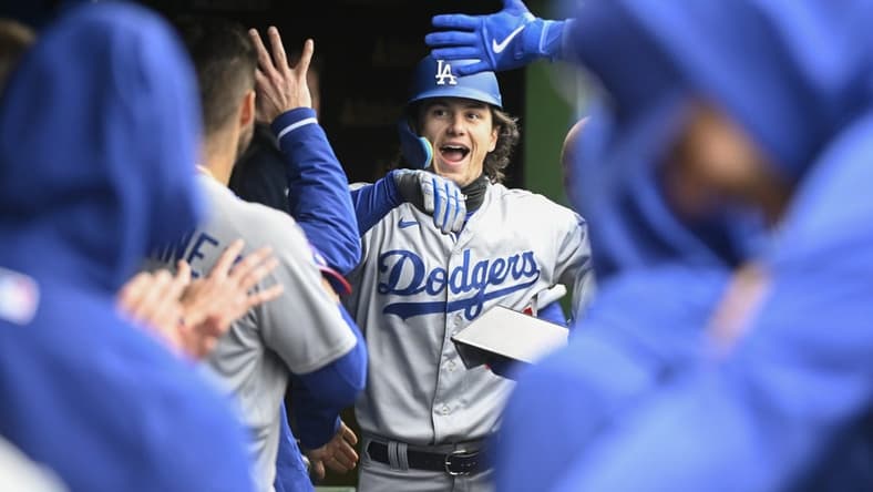 Apr 22, 2023; Chicago, Illinois, USA; Los Angeles Dodgers center fielder James Outman (33) celebrates in the dugout after hitting a home run against the Chicago Cubs during the second inning at Wrigley Field. Mandatory Credit: Matt Marton-USA TODAY Sports