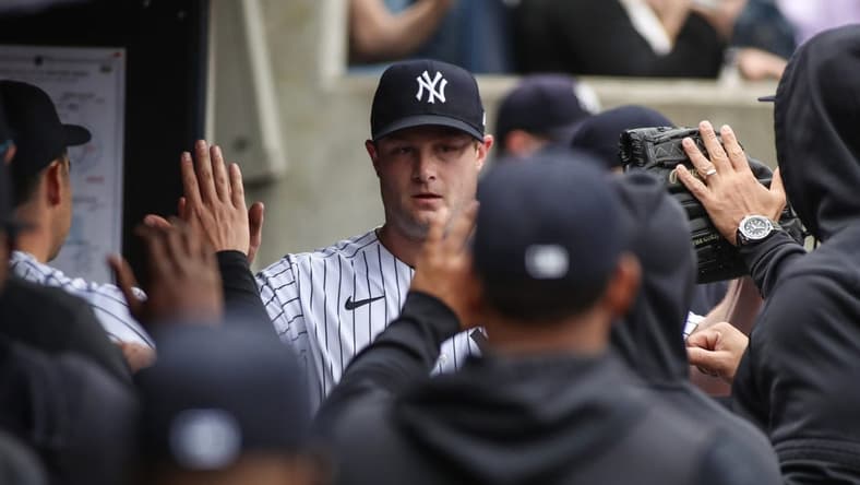 Apr 22, 2023; Bronx, New York, USA;  New York Yankees starting pitcher Gerrit Cole (45) is greeted in the dugout after being taken out in the sixth inning against the Toronto Blue Jays at Yankee Stadium. Mandatory Credit: Wendell Cruz-USA TODAY Sports