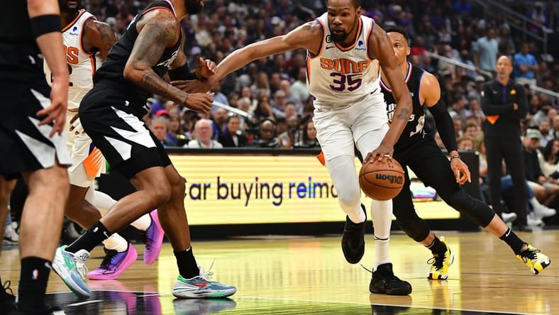 Apr 22, 2023; Los Angeles, California, USA; Phoenix Suns forward Kevin Durant (35) moves to the basket against Los Angeles Clippers forward Marcus Morris Sr. (8) during the first half in game four of the 2023 NBA playoffs at Crypto.com Arena. Mandatory Credit: Gary A. Vasquez-USA TODAY Sports