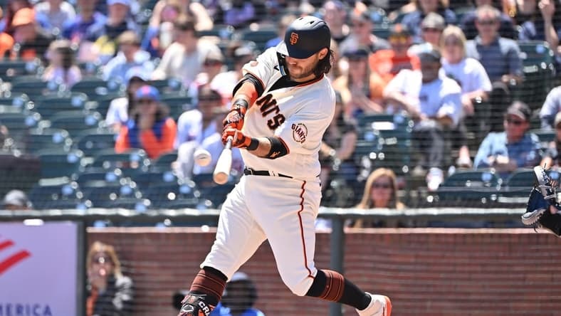 Apr 22, 2023; San Francisco, California, USA; San Francisco Giants infielder Brandon Crawford (35) hits a three run home run against New York Mets starting pitcher David Peterson (23) during the first inning at Oracle Park. Mandatory Credit: Robert Edwards-USA TODAY Sports