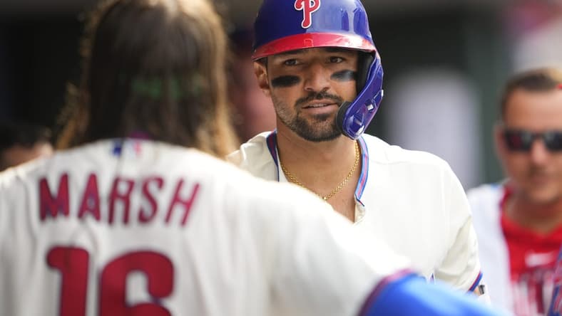 Apr 22, 2023; Philadelphia, Pennsylvania, USA; Philadelphia Phillies right fielder Nick Castellanos (8) is congratulated by center fielder Brandon Marsh (16) for hitting a home run against the Colorado Rockies during the sixth inning at Citizens Bank Park. Mandatory Credit: Gregory Fisher-USA TODAY Sports