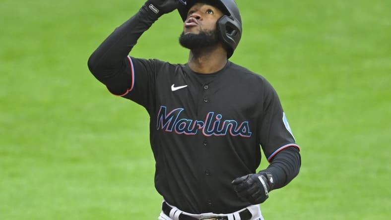 Apr 22, 2023; Cleveland, Ohio, USA; Miami Marlins left fielder Bryan De La Cruz (14) celebrates after hitting a solo home run against the Cleveland Guardians in the sixth inning at Progressive Field. Mandatory Credit: David Richard-USA TODAY Sports