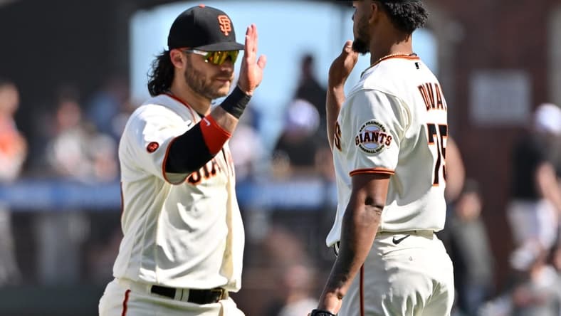 Apr 22, 2023; San Francisco, California, USA; San Francisco Giants pitcher Camilo Doval (75) shakes hands with infielder Brandon Crawford (35) after the final out of the ninth inning against the New York Mets at Oracle Park. Mandatory Credit: Robert Edwards-USA TODAY Sports