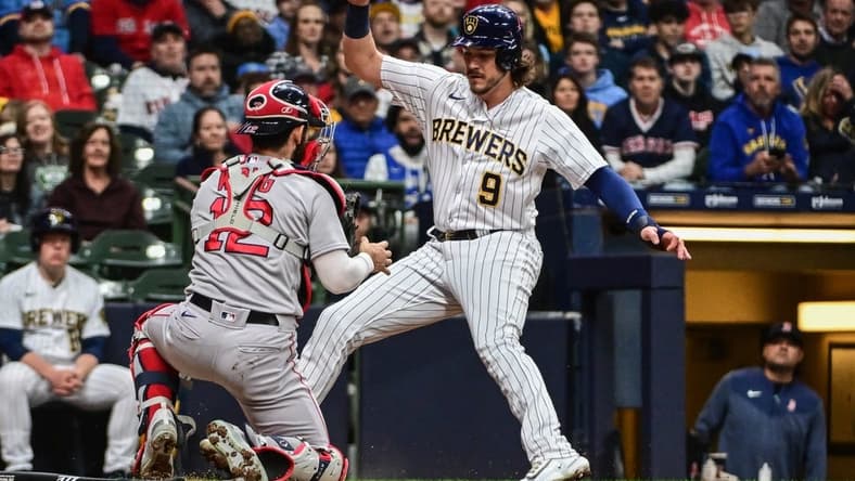Apr 22, 2023; Milwaukee, Wisconsin, USA; Milwaukee Brewers third baseman Brian Anderson (9) is tagged out by Boston Red Sox catcher Connor Wong (12) while trying to score in the second inning at American Family Field. Mandatory Credit: Benny Sieu-USA TODAY Sports