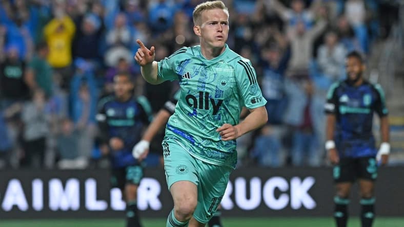 Apr 22, 2023; Charlotte, North Carolina, USA; Charlotte FC attacker Karol Swiderski (11) celebrates after scoring a goal against Columbus Crew in the first half at Bank of America Stadium. Mandatory Credit: Griffin Zetterberg-USA TODAY Sports