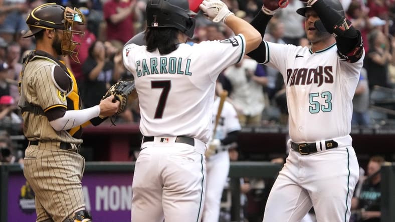 Apr 22, 2023; Phoenix, Arizona, USA; Arizona Diamondbacks first baseman Christian Walker (53) celebrates with left fielder Corbin Carroll (7) after hitting a two run home run against the San Diego Padres in the third inning at Chase Field. Mandatory Credit: Rick Scuteri-USA TODAY Sports