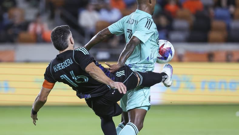 Apr 22, 2023; Houston, Texas, USA; Houston Dynamo FC midfielder Hector Herrera (16) attempts to control the ball away from Inter Miami CF midfielder Dixon Arroyo (3) during the first half at Shell Energy Stadium. Mandatory Credit: Troy Taormina-USA TODAY Sports
