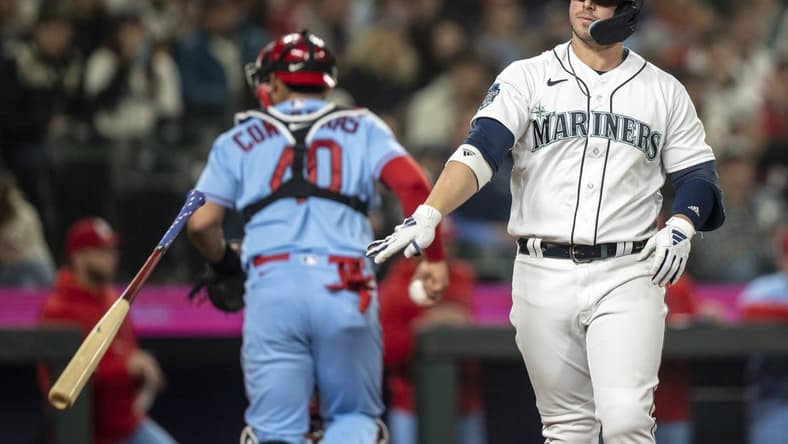 Apr 22, 2023; Seattle, Washington, USA; Seattle Mariners first baseman Ty France (23) throws down his bat after striking about during the fifth inning against the St. Louis Cardinals at T-Mobile Park. Mandatory Credit: Stephen Brashear-USA TODAY Sports