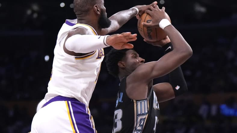 Apr 22, 2023; Los Angeles, California, USA; Los Angeles Lakers forward LeBron James (6) blocks a shot by Memphis Grizzlies forward Jaren Jackson Jr. (13) in the fourth quarter during game three of the 2023 NBA playoffs at Crypto.com Arena. Mandatory Credit: Kirby Lee-USA TODAY Sports