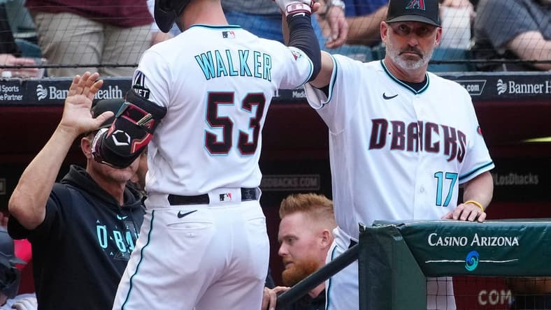 April 22, 2023; Phoenix, Ariz.; USA; Diamondbacks manager Torey Lovullo (R) greets Christian Walker (53) and Corbin Carroll (7) after a Walker two-run home run against the Padres in the third inning during a game at Chase Field.

Mlb Padres At D Backs