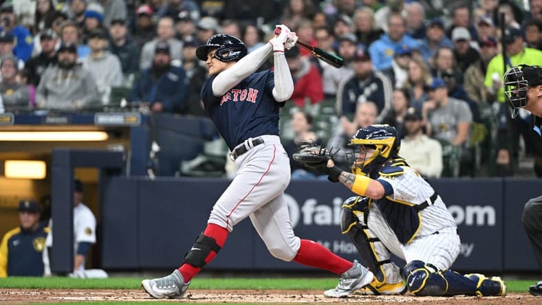 Apr 23, 2023; Milwaukee, Wisconsin, USA; Boston Red Sox shortstop Yu Chang (20) at bat against the Milwaukee Brewers in the second inning at American Family Field. Mandatory Credit: Michael McLoone-USA TODAY Sports