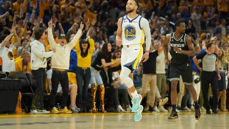 Apr 23, 2023; San Francisco, California, USA; Golden State Warriors guard Stephen Curry (30) reacts after scoring against the Sacramento Kings during the second quarter of game four of the 2023 NBA playoffs at Chase Center. Mandatory Credit: Darren Yamashita-USA TODAY Sports