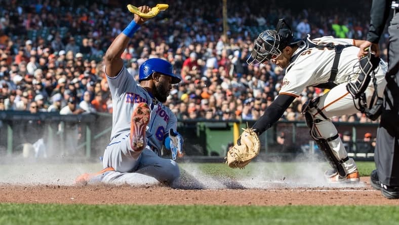 Apr 23, 2023; San Francisco, California, USA; New York Mets right fielder Starling Marte (6) slides home to score in front of San Francisco Giants catcher Blake Sabol (2) during the third inning at Oracle Park. Mandatory Credit: John Hefti-USA TODAY Sports