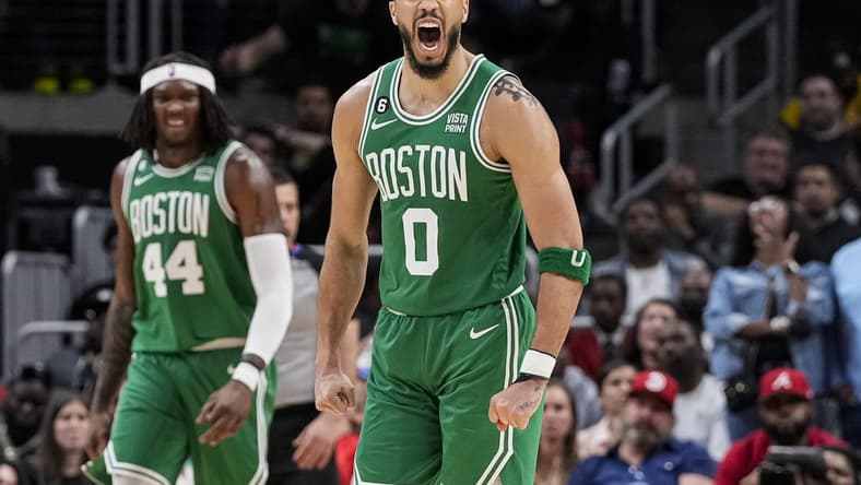Apr 23, 2023; Atlanta, Georgia, USA; Boston Celtics forward Jayson Tatum (0) reacts after making a long three point shot against the Atlanta Hawks during the second half during game four of the 2023 NBA playoffs at State Farm Arena. Mandatory Credit: Dale Zanine-USA TODAY Sports