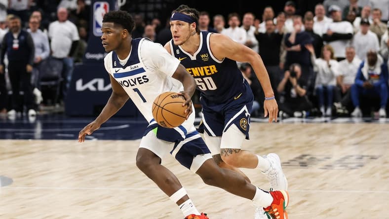 Apr 23, 2023; Minneapolis, Minnesota, USA; Minnesota Timberwolves guard Anthony Edwards (1) drives while Denver Nuggets forward Aaron Gordon (50) defends during overtime of game four of the 2023 NBA Playoffs at Target Center. Mandatory Credit: Matt Krohn-USA TODAY Sports