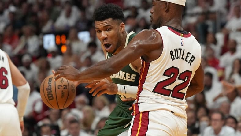 Apr 24, 2023; Miami, Florida, USA; Miami Heat forward Jimmy Butler (22) defends Milwaukee Bucks forward Giannis Antetokounmpo (34) in the first quarter during game four of the 2023 NBA Playoffs at Kaseya Center. Mandatory Credit: Jim Rassol-USA TODAY Sports