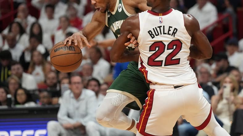 Apr 24, 2023; Miami, Florida, USA; Miami Heat forward Jimmy Butler (22) defends Milwaukee Bucks forward Giannis Antetokounmpo (34) in the first quarter during game four of the 2023 NBA Playoffs at Kaseya Center. Mandatory Credit: Jim Rassol-USA TODAY Sports