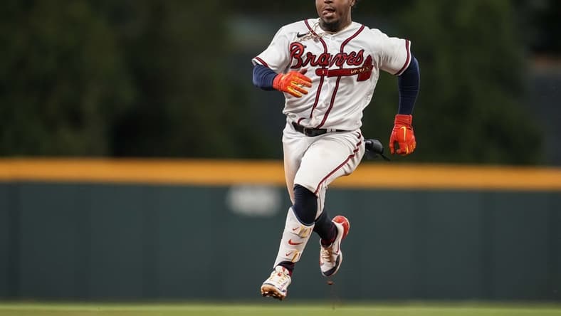 Apr 24, 2023; Cumberland, Georgia, USA; Atlanta Braves second baseman Ozzie Albies (1) runs the bases after hitting a three run triple against the Miami Marlins during the eighth inning at Truist Park. Mandatory Credit: Dale Zanine-USA TODAY Sports