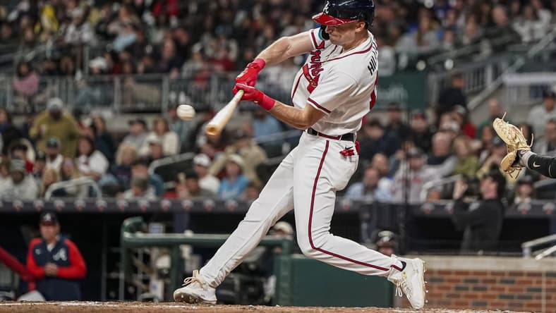 Apr 24, 2023; Cumberland, Georgia, USA; Atlanta Braves center fielder Sam Hilliard (14) hits a home run against the Miami Marlins during the sixth inning at Truist Park. Mandatory Credit: Dale Zanine-USA TODAY Sports