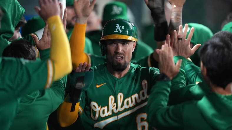 Apr 24, 2023; Anaheim, California, USA; Oakland Athletics third baseman Jace Peterson (6) celebrates after scoring in the 10th inning against the Los Angeles Angels at Angel Stadium. Mandatory Credit: Kirby Lee-USA TODAY Sports