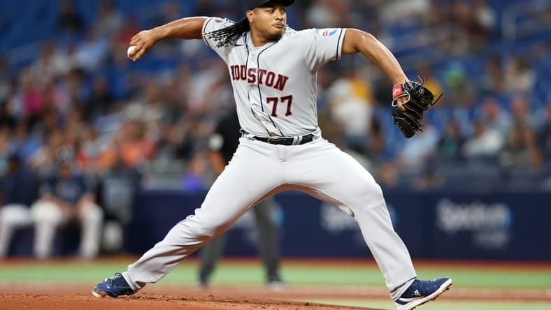 Apr 25, 2023; St. Petersburg, Florida, USA;  Houston Astros starting pitcher Luis Garcia (77) throws a pitch against the Tampa Bay Rays in the first inning at Tropicana Field. Mandatory Credit: Nathan Ray Seebeck-USA TODAY Sports