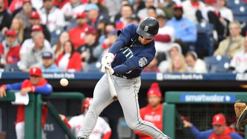 Apr 25, 2023; Philadelphia, Pennsylvania, USA; Seattle Mariners left fielder Jarred Kelenic (10) hits a double during the second inning against the Philadelphia Phillies at Citizens Bank Park. Mandatory Credit: Eric Hartline-USA TODAY Sports