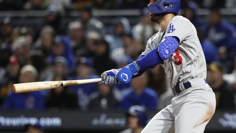 Apr 25, 2023; Pittsburgh, Pennsylvania, USA;  Los Angeles Dodgers third baseman Chris Taylor (3) hits a there run home run against the Pittsburgh Pirates during the eighth inning at PNC Park. Mandatory Credit: Charles LeClaire-USA TODAY Sports