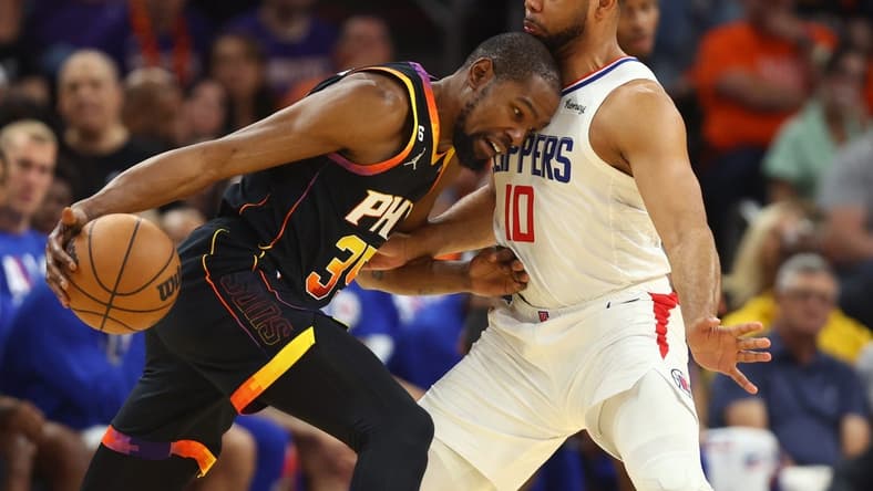 Apr 25, 2023; Phoenix, Arizona, USA; Phoenix Suns forward Kevin Durant (35) drives to the basket against Los Angeles Clippers guard Eric Gordon (10) during the first half in game five of the 2023 NBA playoffs at Footprint Center. Mandatory Credit: Mark J. Rebilas-USA TODAY Sports