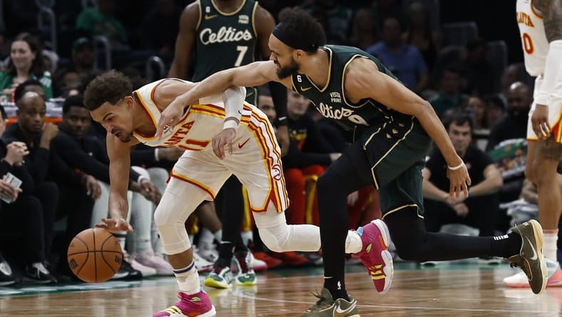 Apr 25, 2023; Boston, Massachusetts, USA; Atlanta Hawks guard Trae Young (11) gathers in a loose ball next to Boston Celtics guard Derrick White (9) during the third quarter of game five of the 2023 NBA playoffs at TD Garden. Mandatory Credit: Winslow Townson-USA TODAY Sports