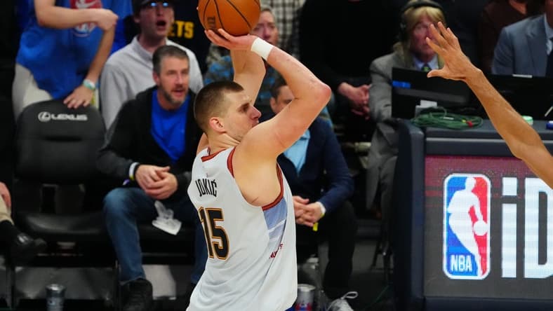 Apr 25, 2023; Denver, Colorado, USA; Denver Nuggets center Nikola Jokic (15) shoots in the second half against the Minnesota Timberwolves in game five of the 2023 NBA Playoffs at Ball Arena. Mandatory Credit: Ron Chenoy-USA TODAY Sports
