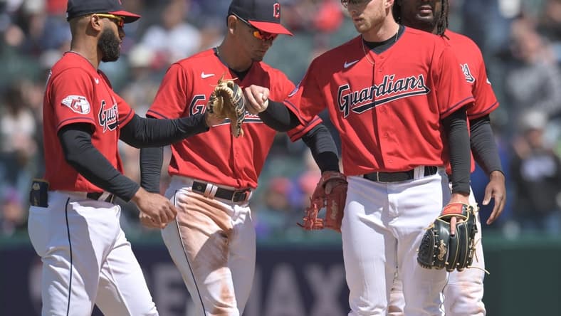 Apr 26, 2023; Cleveland, Ohio, USA; Cleveland Guardians starting pitcher Tanner Bibee, second right, celebrates with shortstop Amed Rosario, left, second baseman Andres Gimenez, second left, and first baseman Josh Bell during the sixth inning against the Colorado Rockies at Progressive Field. Mandatory Credit: Ken Blaze-USA TODAY Sports