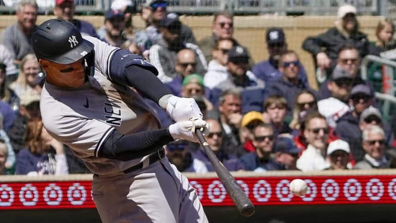 Apr 26, 2023; Minneapolis, Minnesota, USA; New York Yankees designated hitter Aaron Judge (99) hits a single against the Minnesota Twins during the fifth inning at Target Field. Mandatory Credit: Nick Wosika-USA TODAY Sports