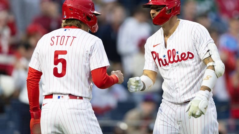 Apr 26, 2023; Philadelphia, Pennsylvania, USA; Philadelphia Phillies right fielder Nick Castellanos (8) is congratulated by second baseman Bryson Stott (5) after hitting a two RBI home run during the first inning against the Seattle Mariners at Citizens Bank Park. Mandatory Credit: Bill Streicher-USA TODAY Sports