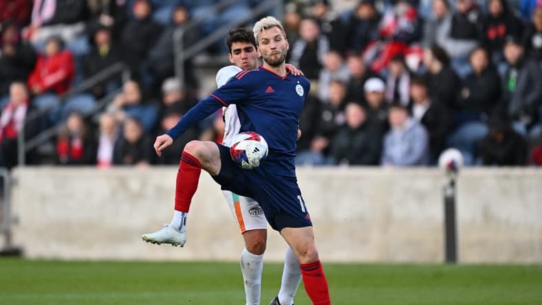 Apr 26, 2023; Bridgeview, IL, USA;  Chicago Fire FC forward Kacper Przybylko (11) takes control of the ball in front of Chicago House AC midfielder Nassouh Kabbani (15) in the first half at SeatGeek Stadium. Mandatory Credit: Jamie Sabau-USA TODAY Sports