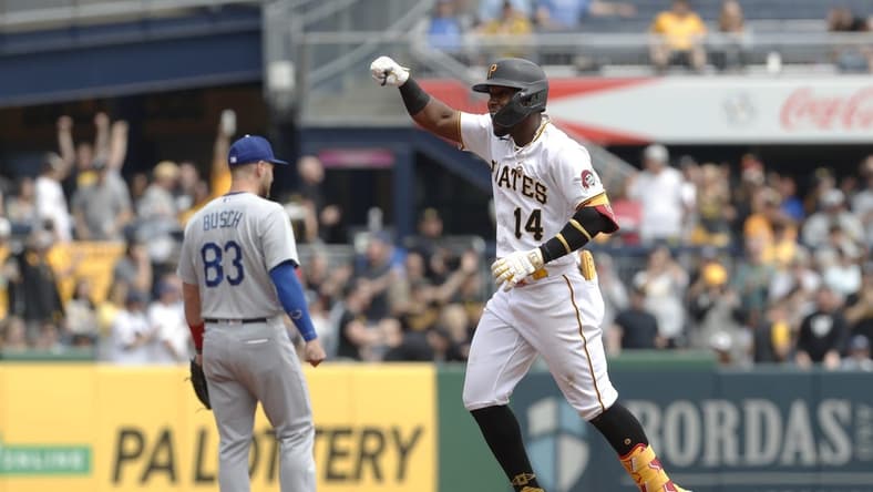 Apr 27, 2023; Pittsburgh, Pennsylvania, USA;  Pittsburgh Pirates shortstop Rodolfo Castro (14) reacts as he circles the bases on a solo home run against the Los Angeles Dodgers during the sixth inning at PNC Park. Mandatory Credit: Charles LeClaire-USA TODAY Sports