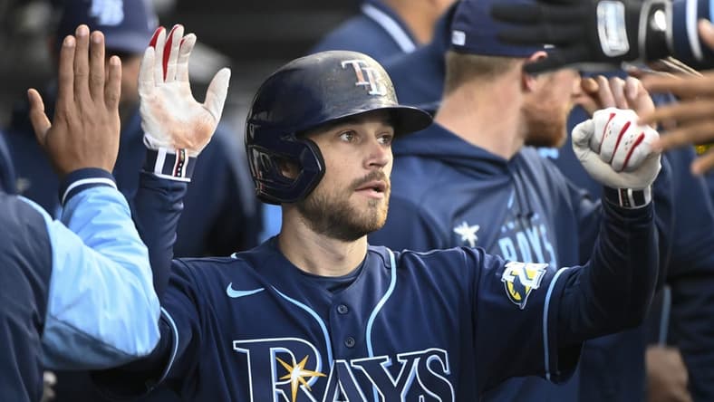 Apr 27, 2023; Chicago, Illinois, USA; Tampa Bay Rays second baseman Brandon Lowe (8) celebrates in the dugout after scoring against the Chicago White Sox during the second inning at Guaranteed Rate Field. Mandatory Credit: Matt Marton-USA TODAY Sports