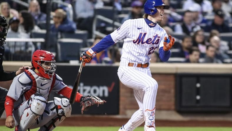 Apr 27, 2023; New York City, New York, USA;  New York Mets third baseman Brett Baty (22) hits a single in the second inning against the Washington Nationals at Citi Field. Mandatory Credit: Wendell Cruz-USA TODAY Sports