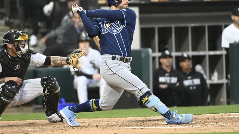 Apr 27, 2023; Chicago, Illinois, USA; Tampa Bay Rays second baseman Brandon Lowe (8) hits a two-run RBI single against the Chicago White Sox during the fifth inning at Guaranteed Rate Field. Mandatory Credit: Matt Marton-USA TODAY Sports