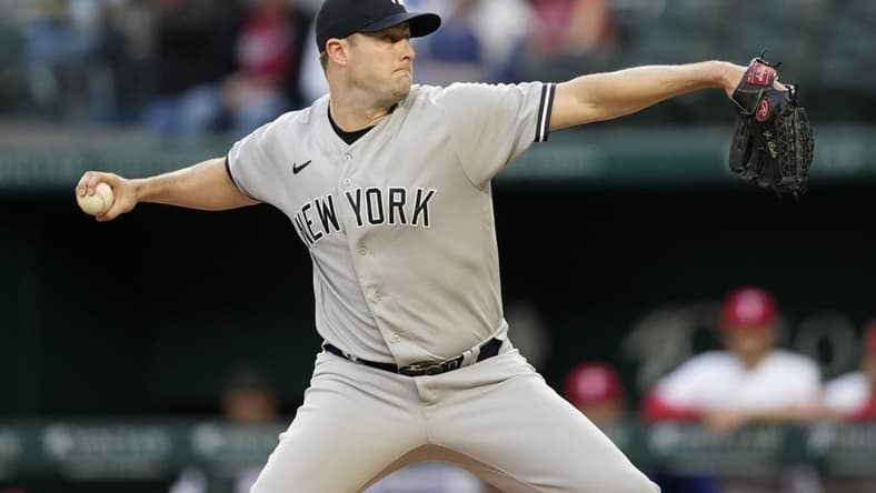 Apr 27, 2023; Arlington, Texas, USA; New York Yankees starting pitcher Gerrit Cole (45) delivers a pitch to the Texas Rangers during the first inning at Globe Life Field. Mandatory Credit: Jim Cowsert-USA TODAY Sports