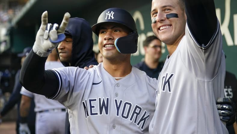 Apr 27, 2023; Arlington, Texas, USA; New York Yankees second baseman Gleyber Torres (25) celebrates his home run with designated hitter Anthony Rizzo (48) against the Texas Rangers during the second inning at Globe Life Field. Mandatory Credit: Jim Cowsert-USA TODAY Sports