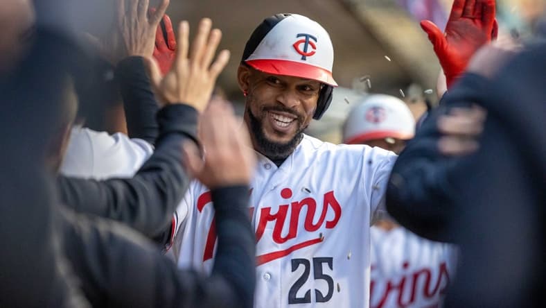 Apr 27, 2023; Minneapolis, Minnesota, USA; Minnesota Twins designated hitter Byron Buxton (25) celebrates with teammates after hitting a three run home run in the fourth inning against the Kansas City Royals at Target Field. Mandatory Credit: Jesse Johnson-USA TODAY Sports