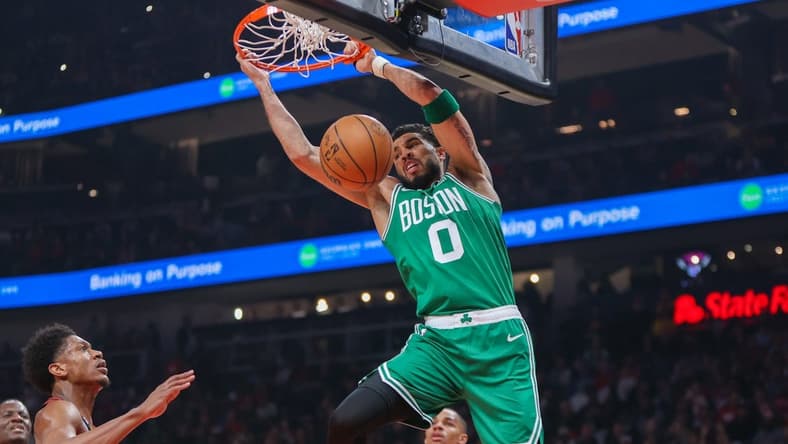 Apr 27, 2023; Atlanta, Georgia, USA; Boston Celtics forward Jayson Tatum (0) dunks the ball against the Atlanta Hawks in the first quarter during game six of the 2023 NBA playoffs at State Farm Arena. Mandatory Credit: Brett Davis-USA TODAY Sports