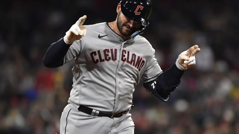 Apr 28, 2023; Boston, Massachusetts, USA; Cleveland Guardians catcher Mike Zunino (10) hits a home run during the fourth inning against the Boston Red Sox at Fenway Park. Mandatory Credit: Bob DeChiara-USA TODAY Sports