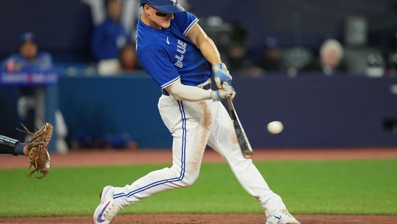 Apr 28, 2023; Toronto, Ontario, CAN; Toronto Blue Jays third baseman Matt Chapman (26) hits a double against the Seattle Mariners during the third inning at Rogers Centre. Mandatory Credit: Nick Turchiaro-USA TODAY Sports