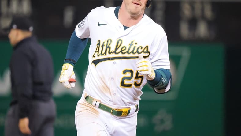 Apr 28, 2023; Oakland, California, USA; Oakland Athletics designated hitter Brent Rooker (25) rounds the bases on a. Two-run home run against the Cincinnati Reds during the ninth inning at Oakland Coliseum. Mandatory Credit: Kelley L Cox-USA TODAY Sports